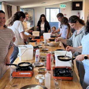 Participants in the GVINAGE ricotta & knafeh workshop making knafeh on individual stoves